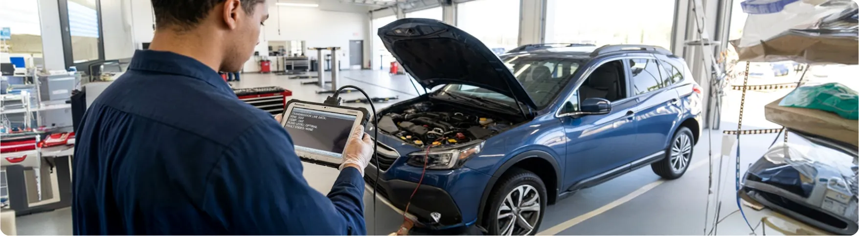 Briggs Subaru of Topeka technician running transmission diagnostics on a Subaru Outback in Topeka, KS